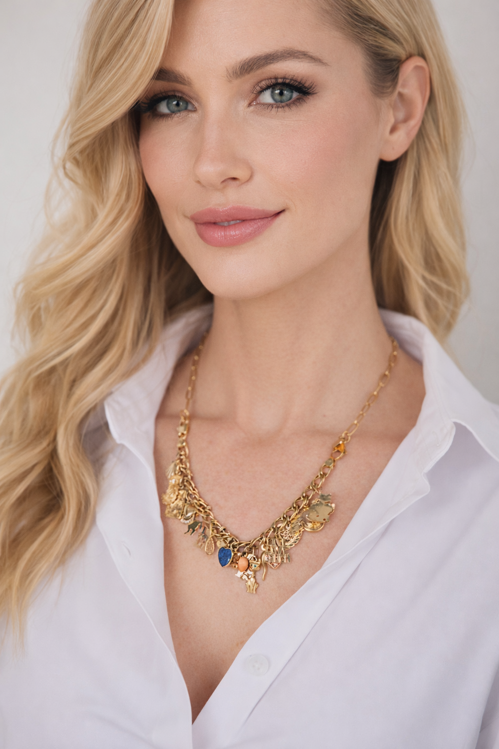 A woman wearing a CharmFlip necklace — a charm bracelet transformed